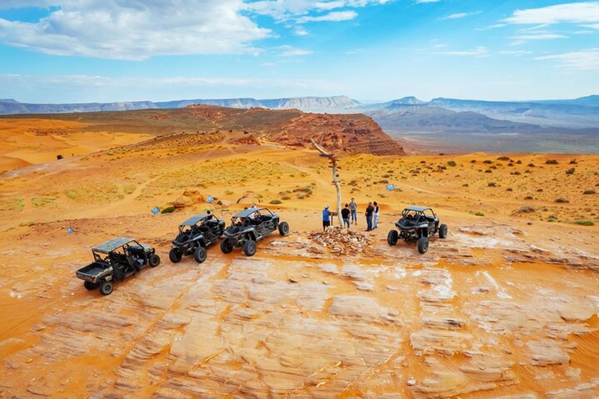 a group of four atvs parked in the desert