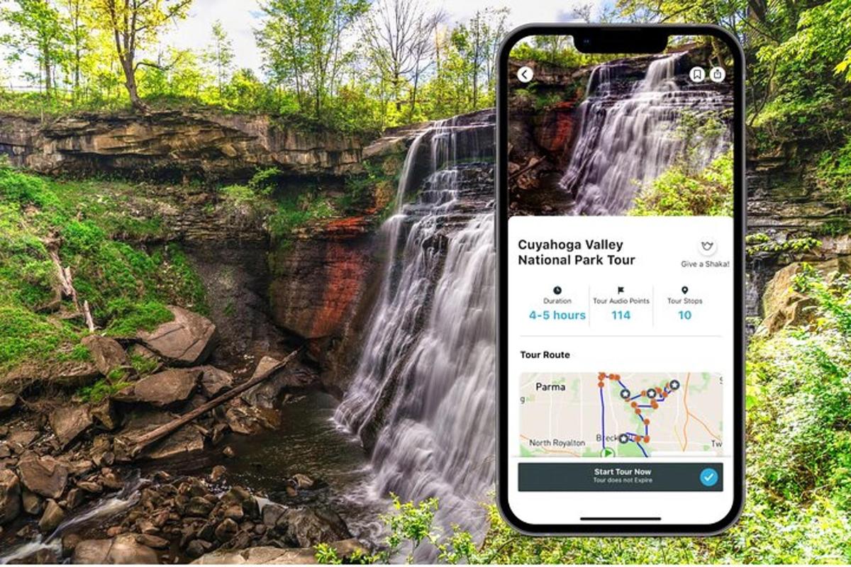 an iphone taking a picture of a waterfall