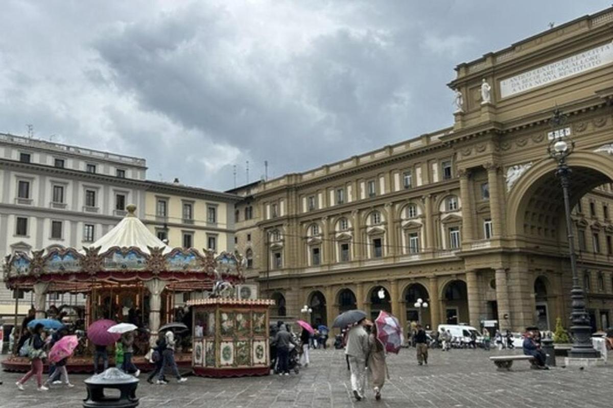 a group of people with umbrellas walking in front of a building