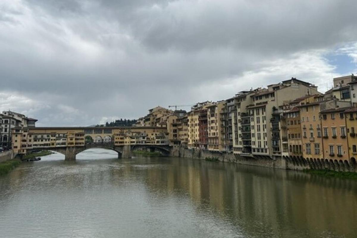 a bridge over a river in a city with buildings