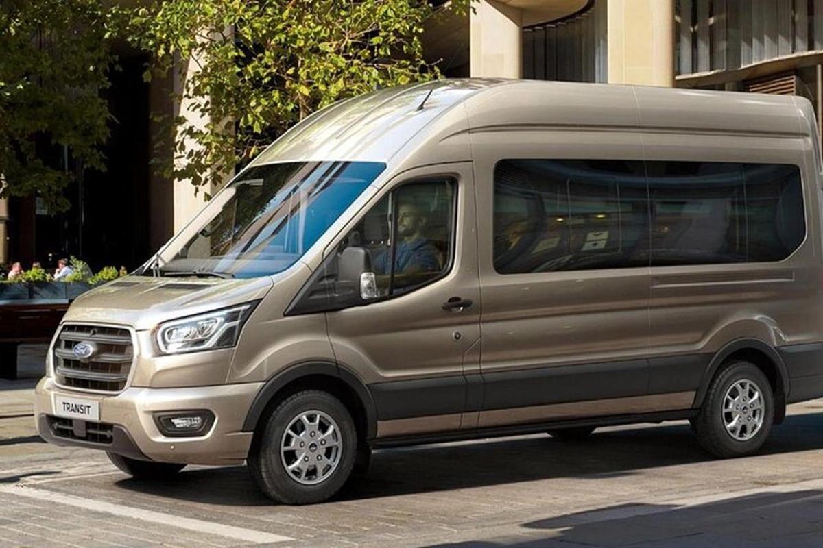 a silver van is parked on a city street