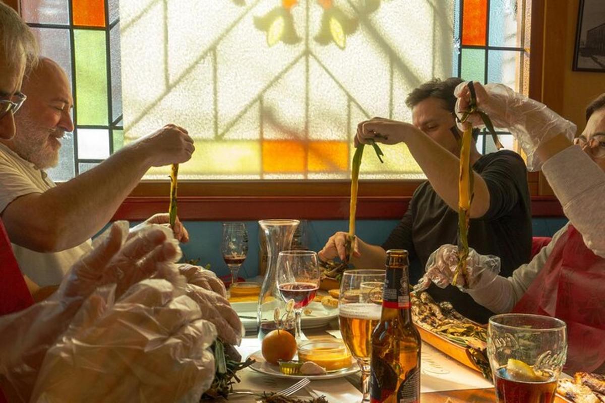 a group of people sitting at a table eating food