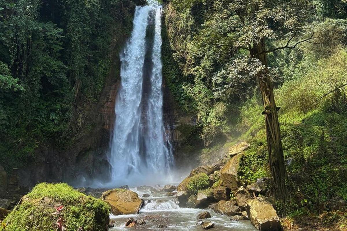 a waterfall in the middle of a river