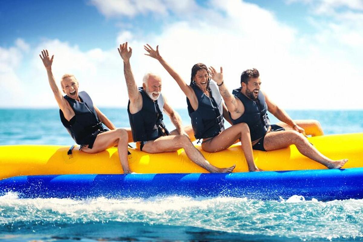 a group of people sitting on a raft in the water