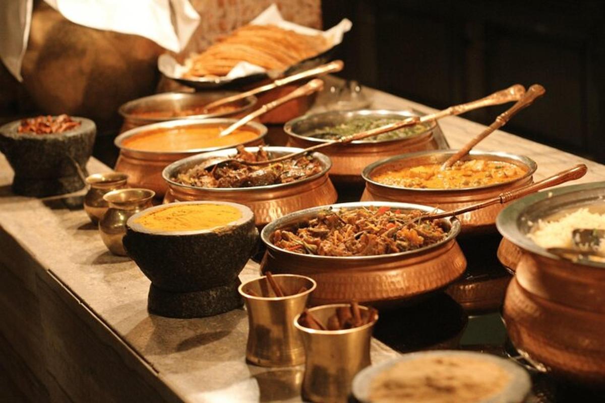 a buffet with many bowls of food on a table