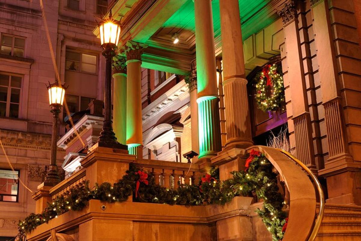 a building with christmas wreaths on a balcony