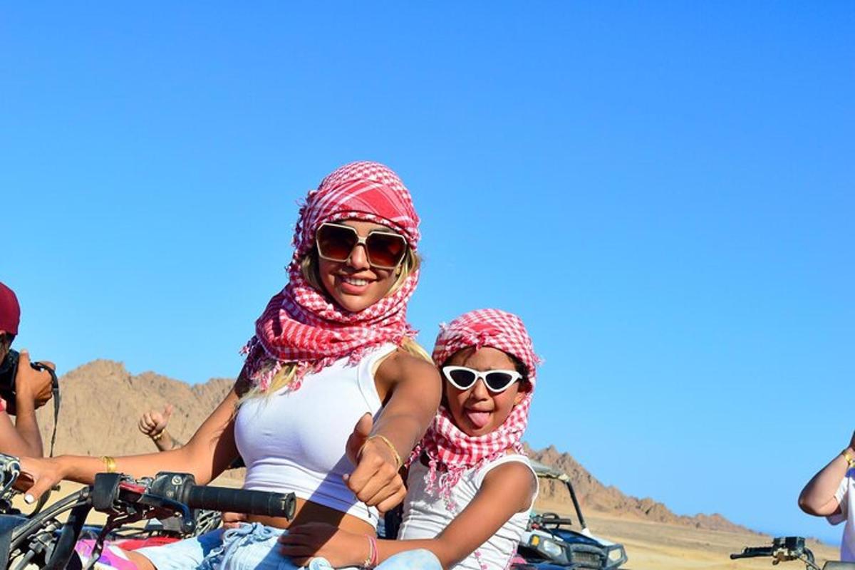 a group of people riding on a motorcycle in the desert