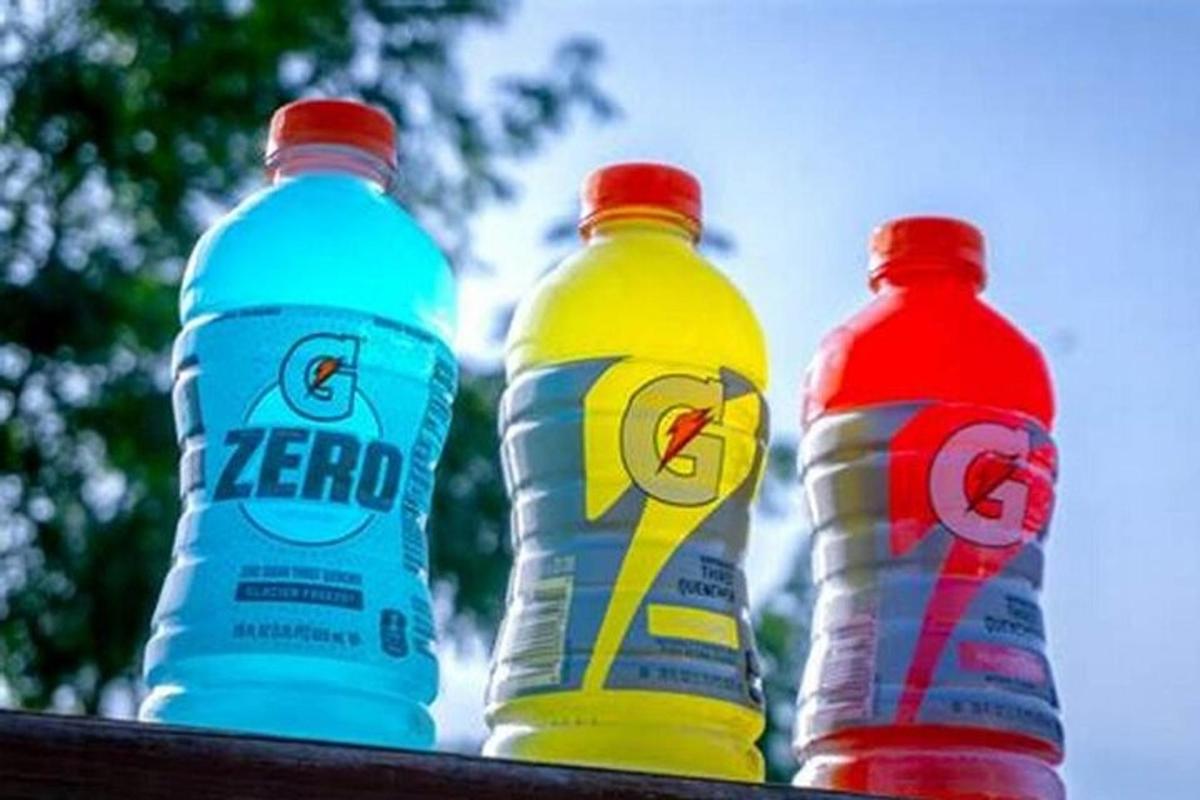three bottles of water sitting on top of a table