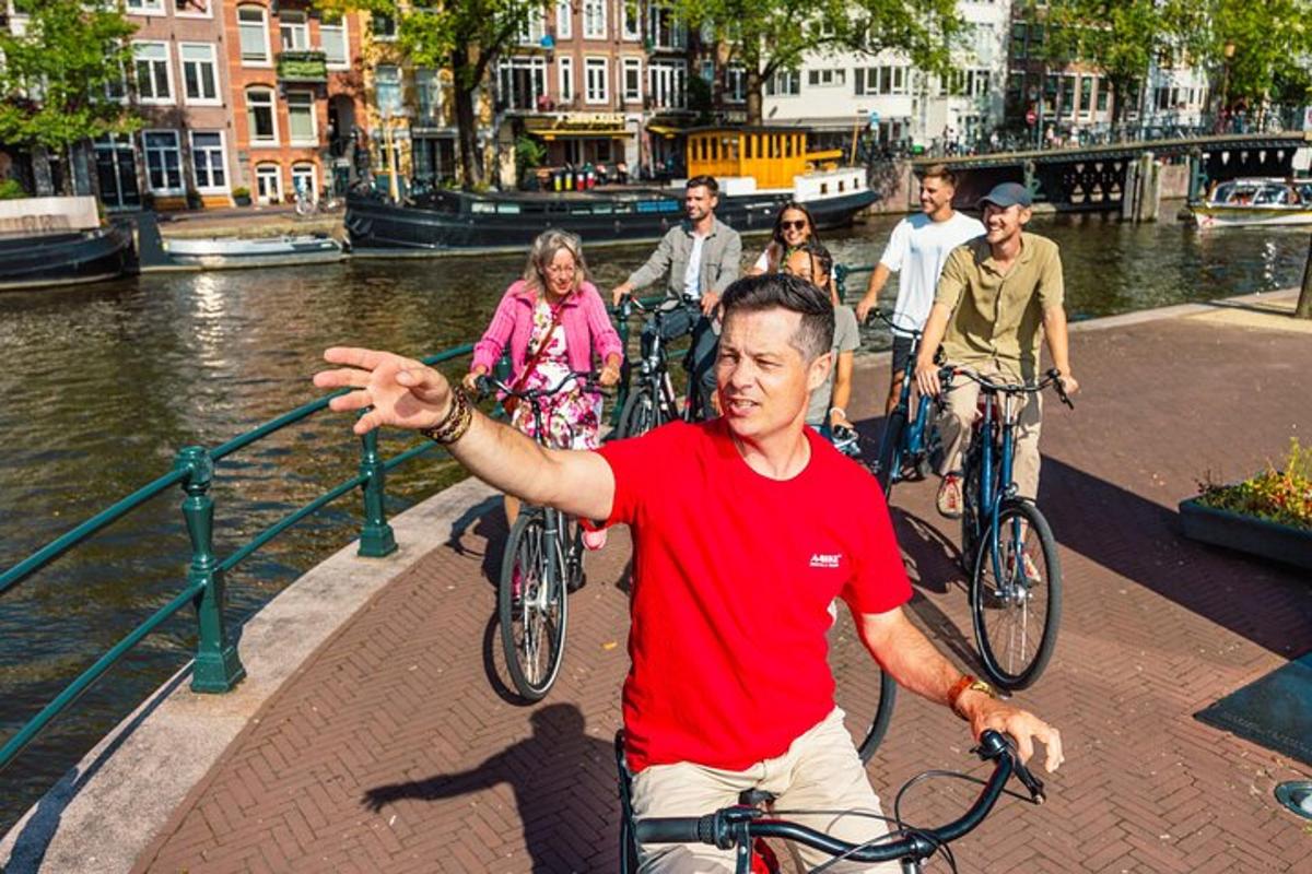 a group of people riding bikes down a river