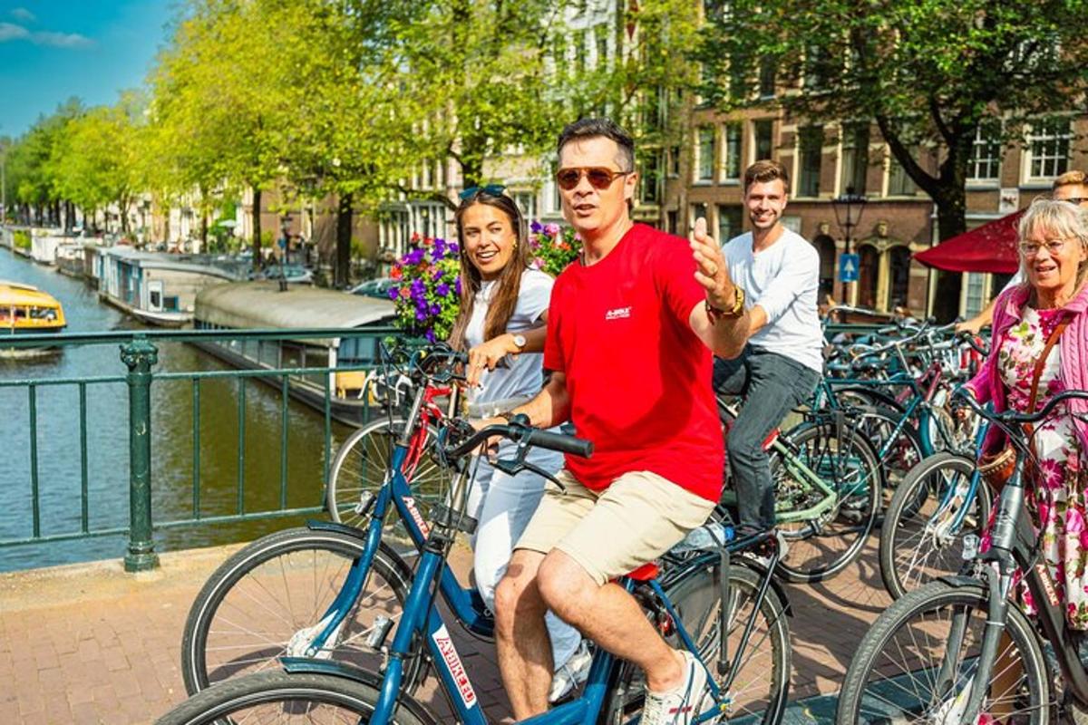 a group of people riding bikes down a canal