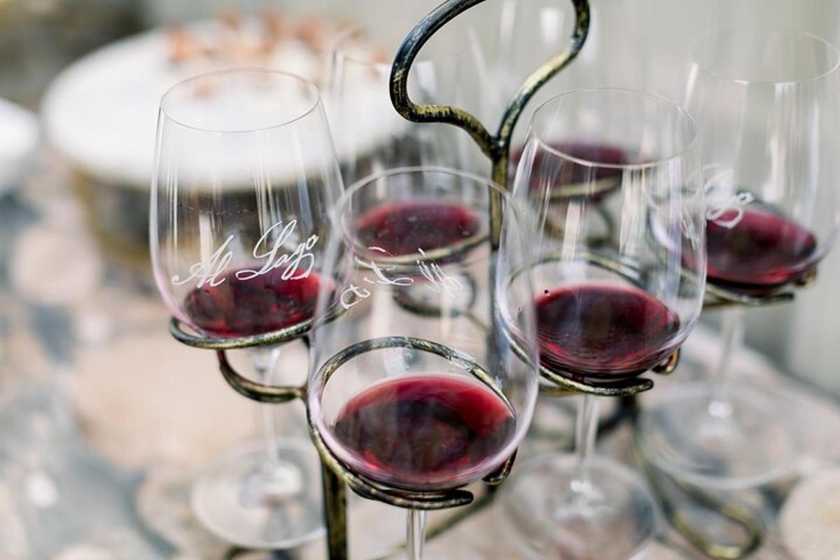 four glasses of red wine sitting on a table