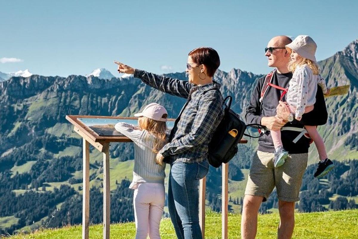 a group of people standing on top of a mountain
