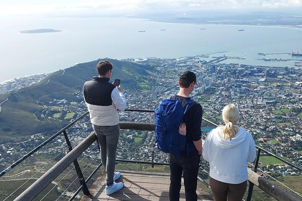 a group of people standing on top of a mountain