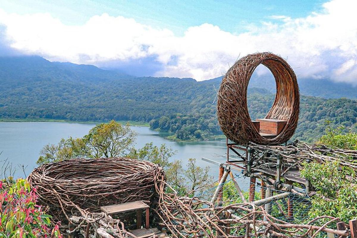 a wicker chair sitting next to a body of water
