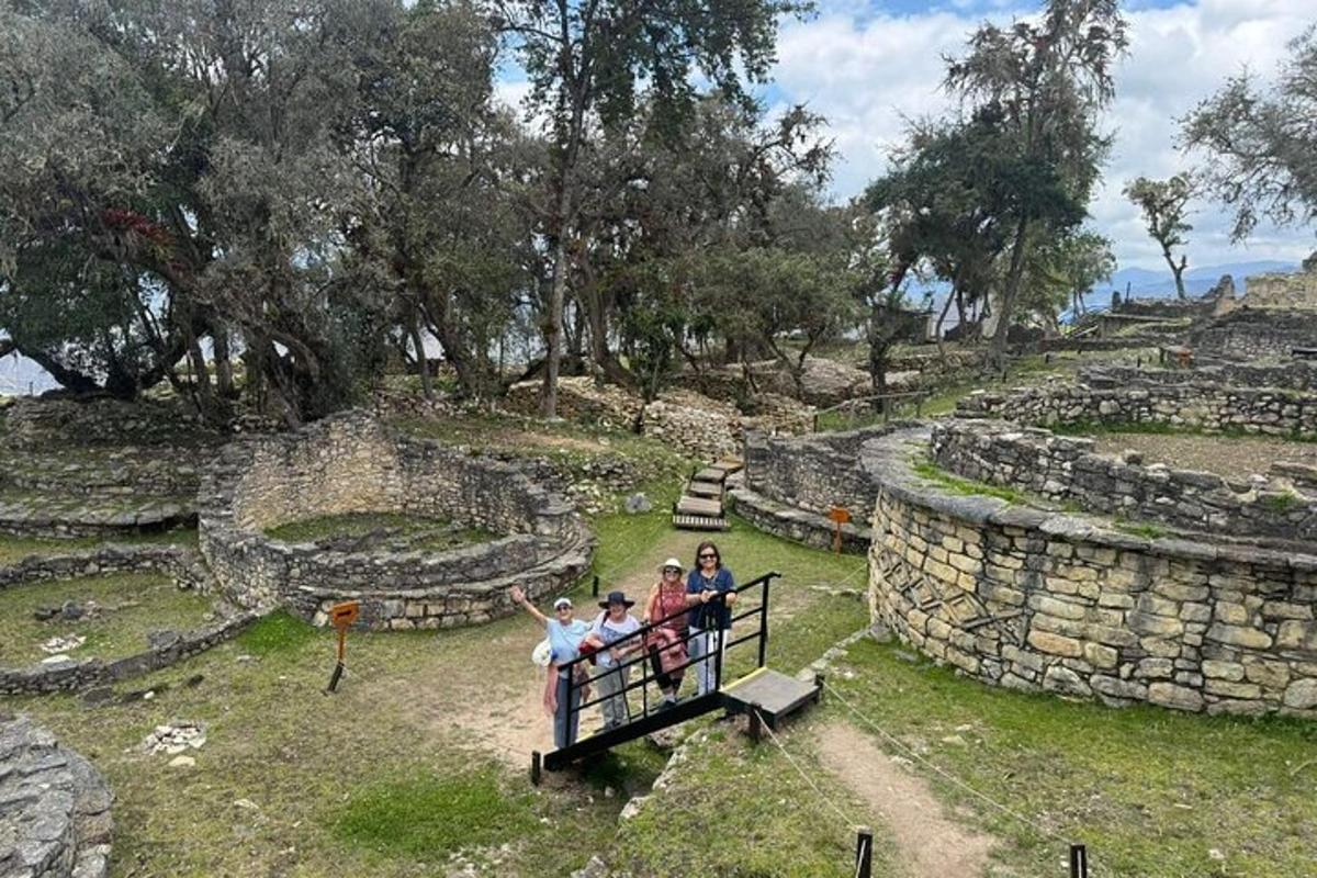 a group of people standing on a balcony at a ruins