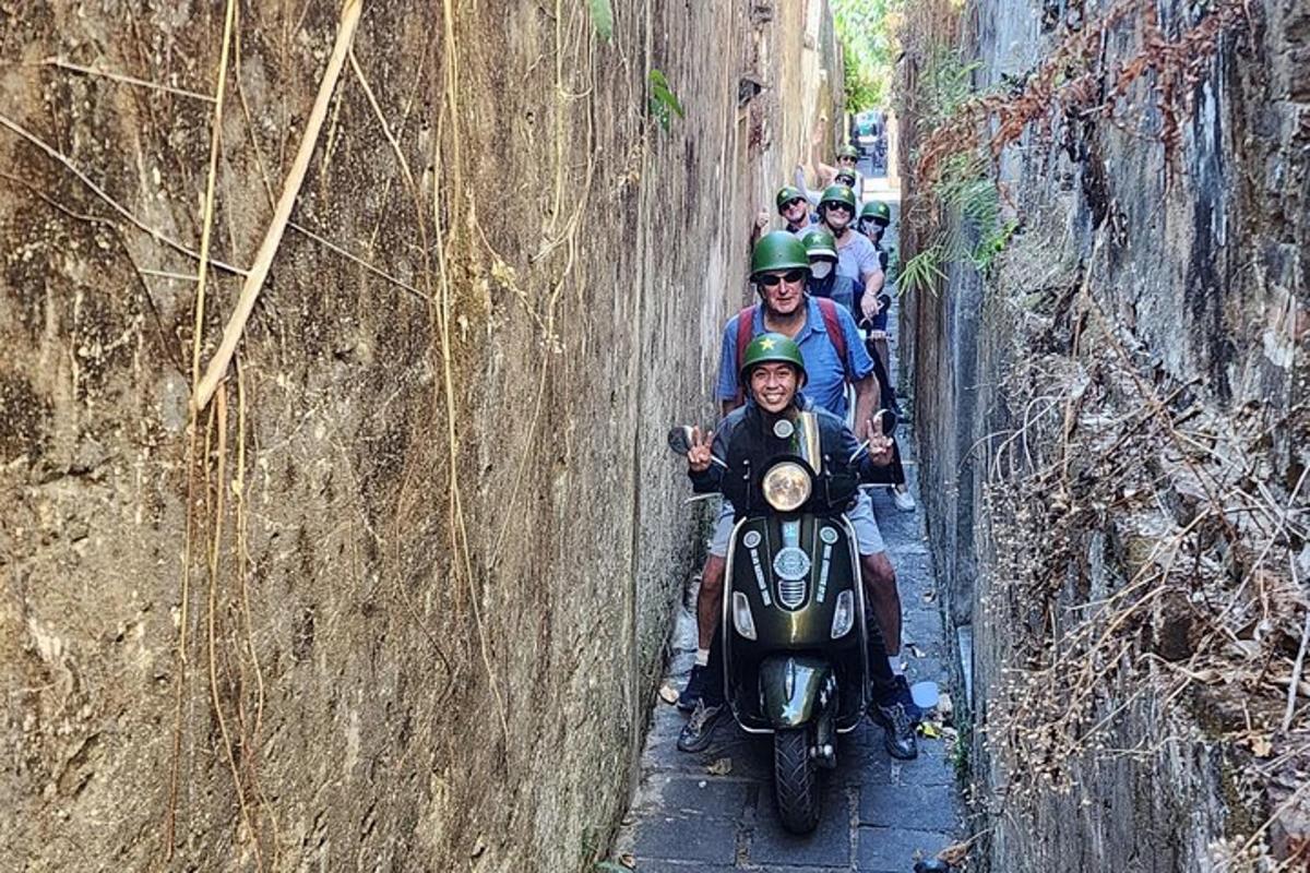 a group of people riding motorcycles on a road