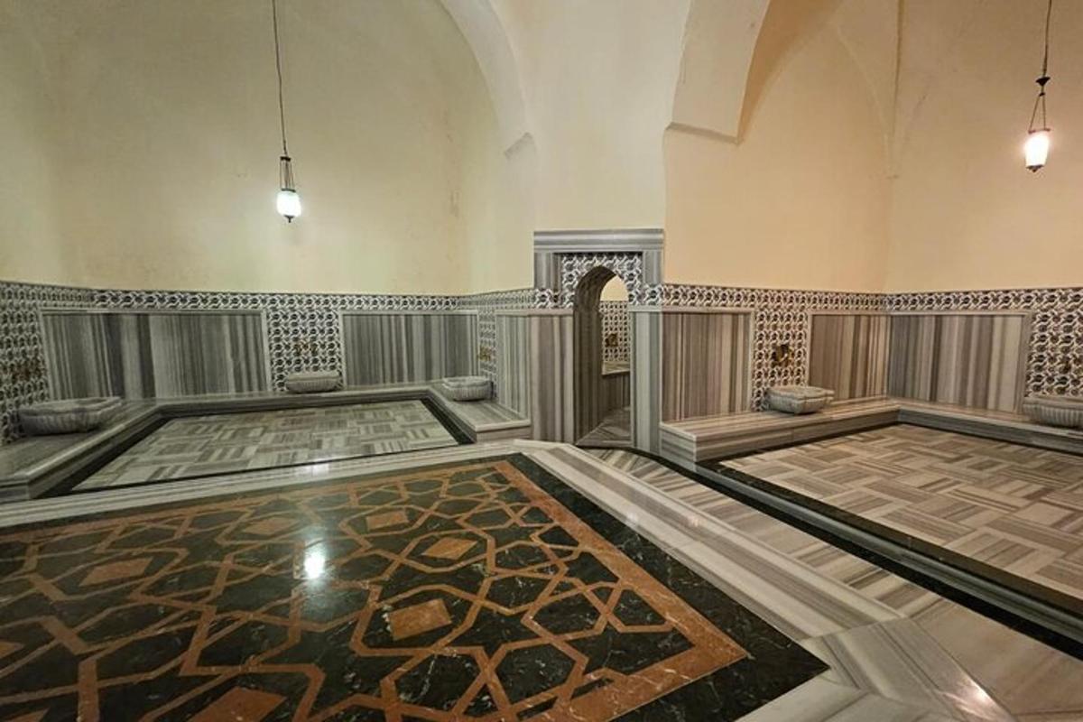 an empty room with a tile floor and a hallway