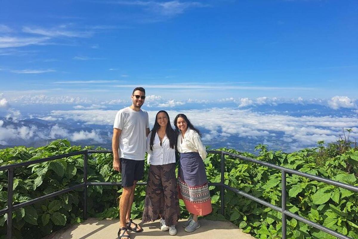 a man and a woman standing on top of a mountain