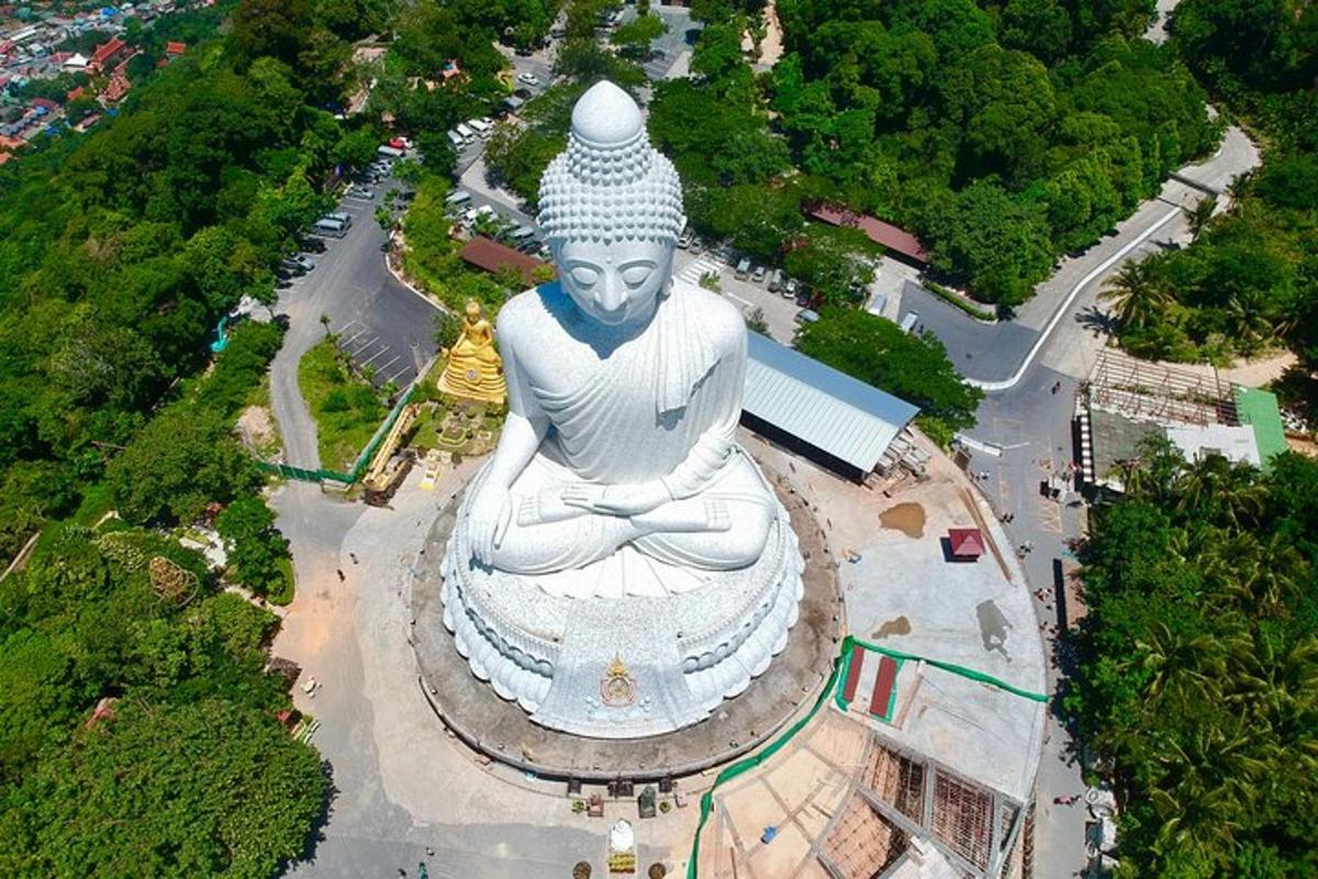 an aerial view of a large statue in a park