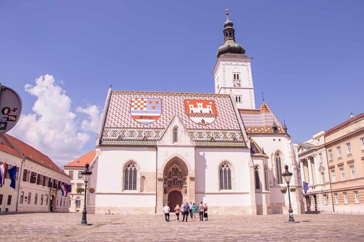 a large building with a clock tower in a city