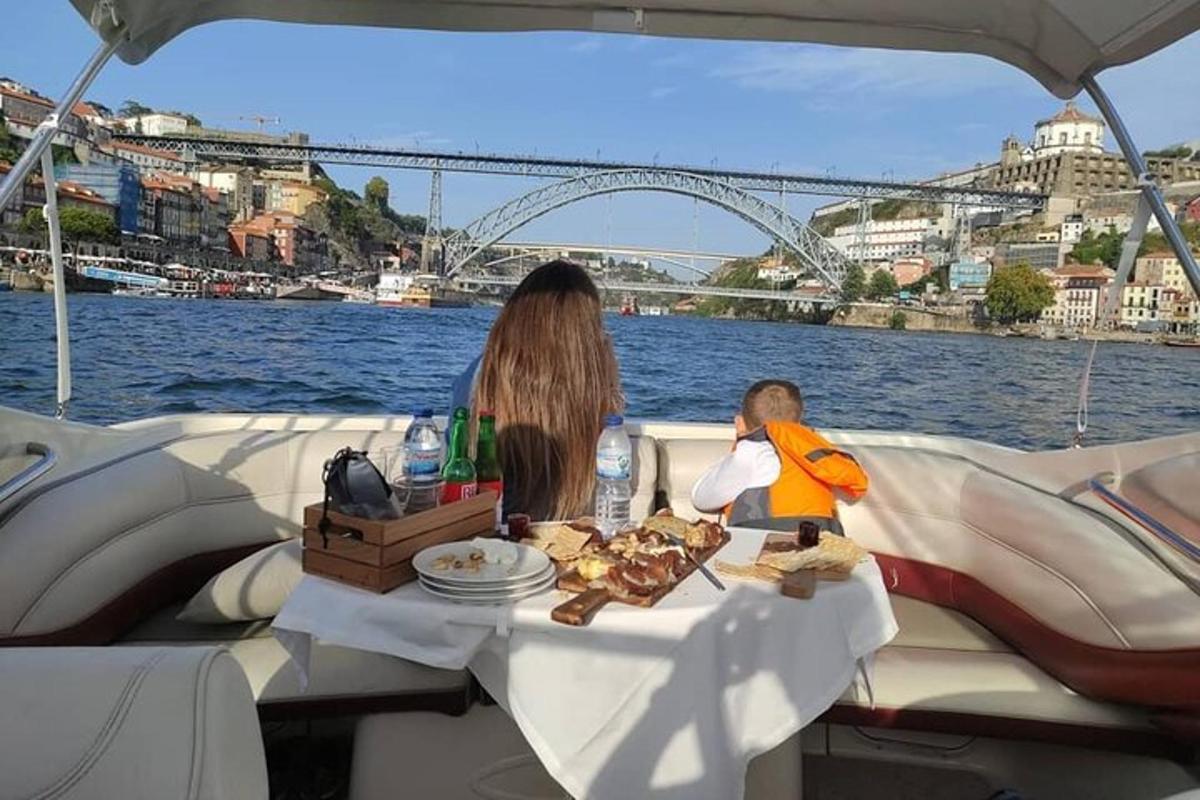 a woman and a child sitting at a table on a boat