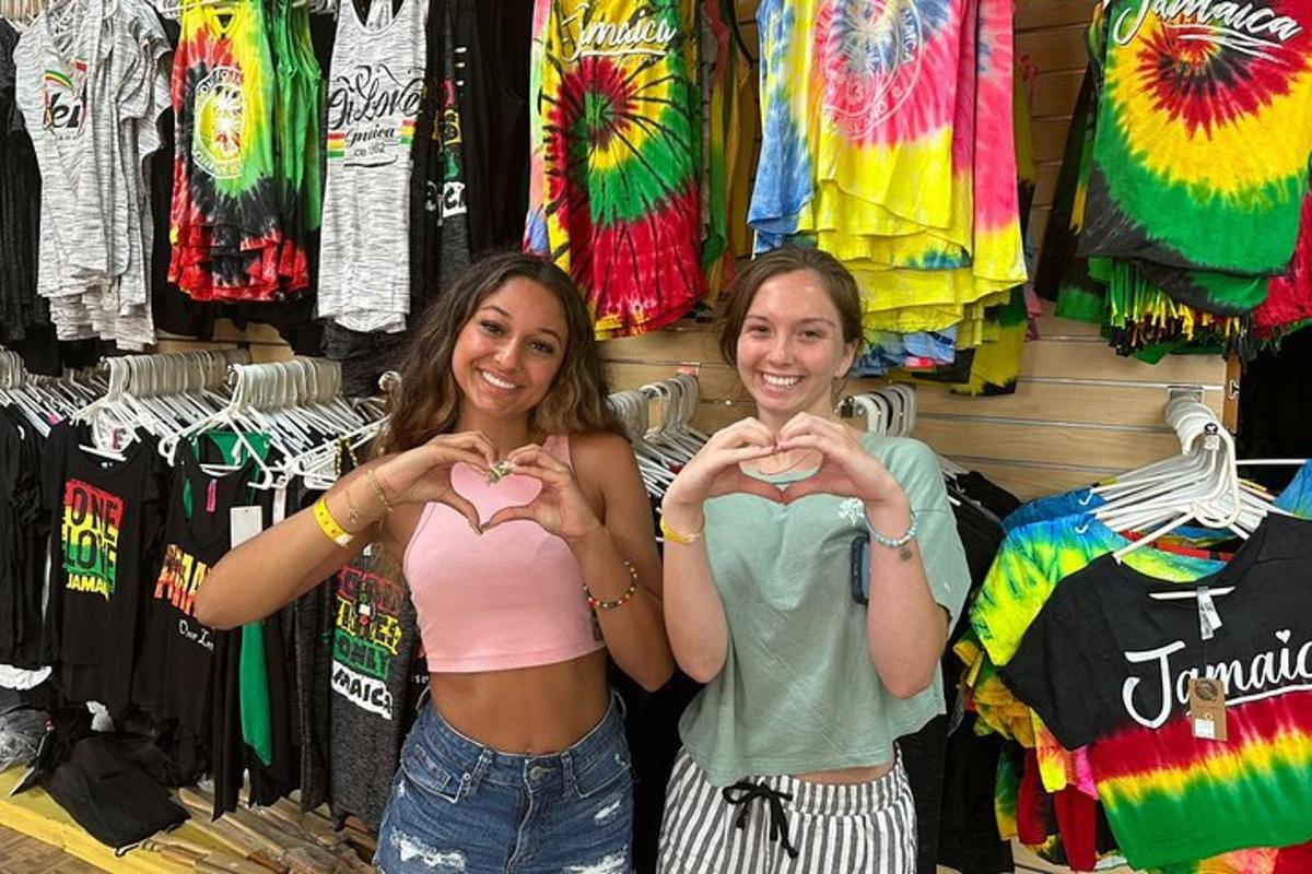 two women making heart signs with their hands