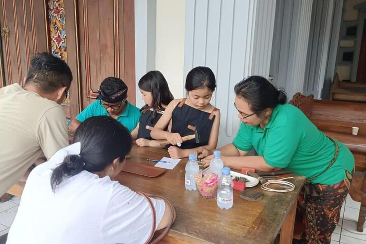 a group of people sitting around a wooden table