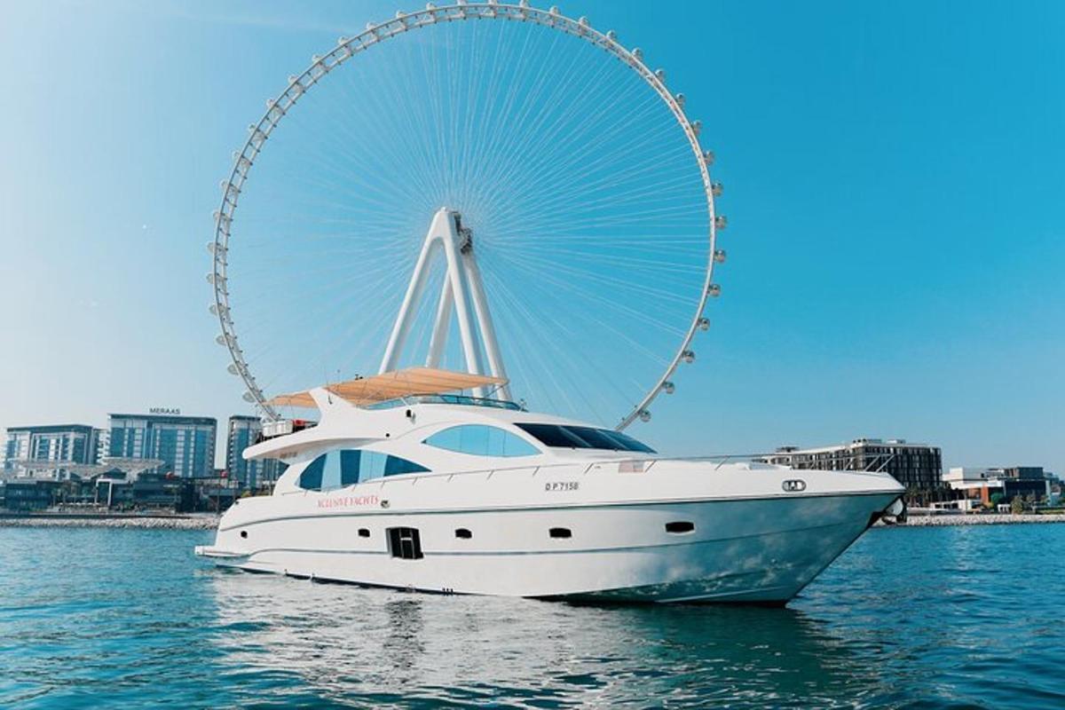 a white boat in the water with a ferris wheel