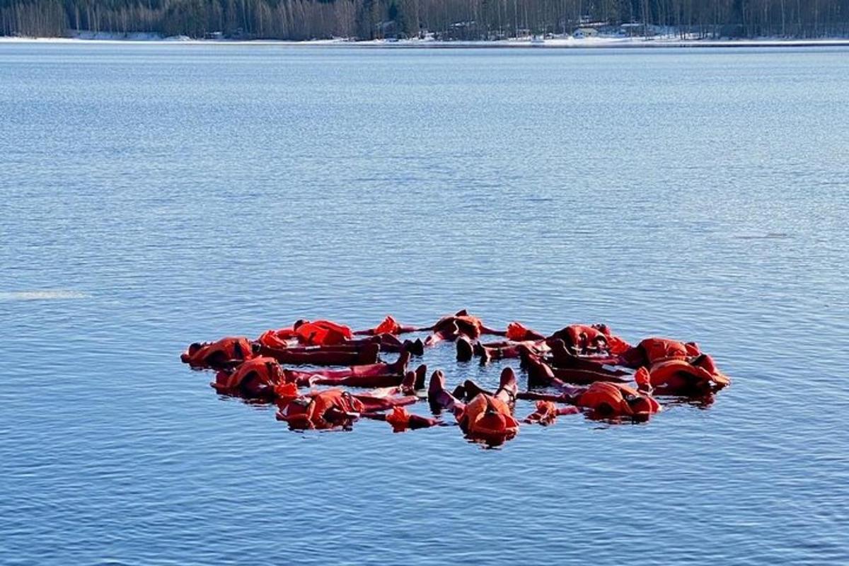 a group of red animals in the water