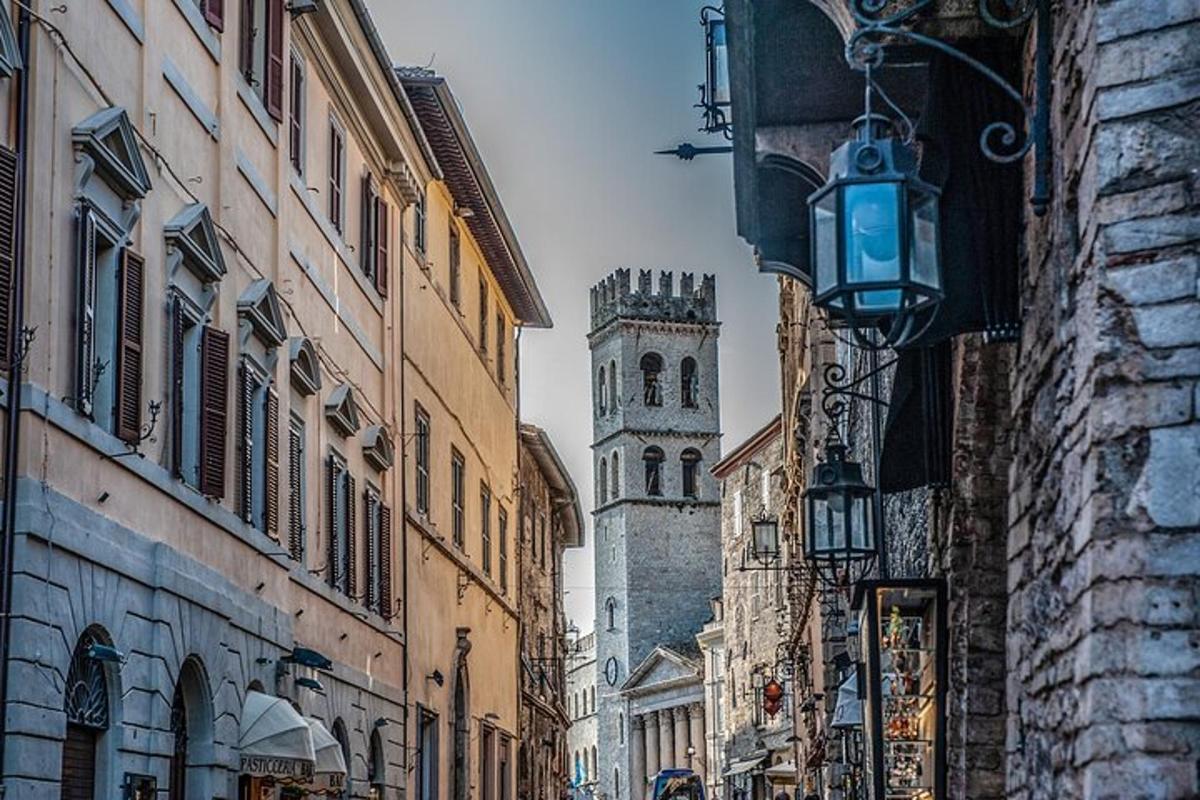 a city street with a clock tower in the distance