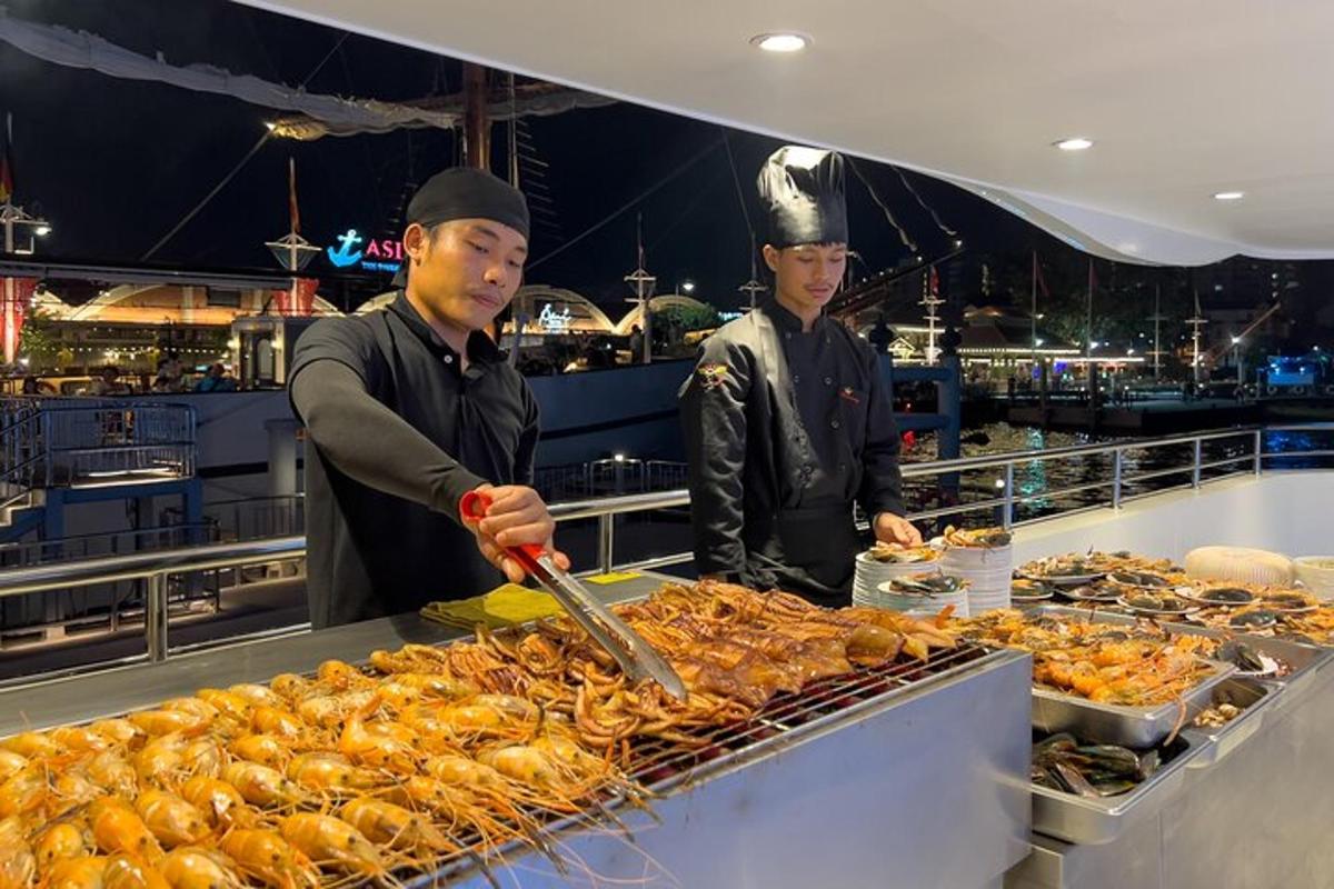 two men preparing food in a restaurant kitchen