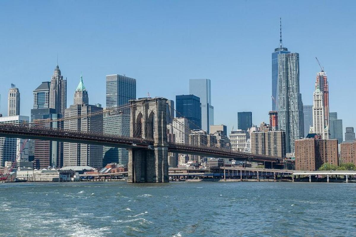 a bridge over the water in front of a city