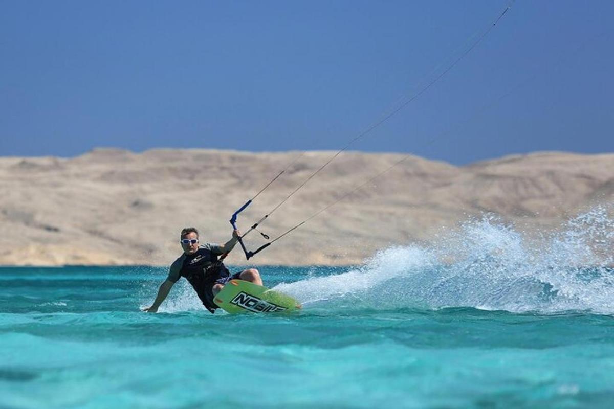 a man on a surfboard in the water