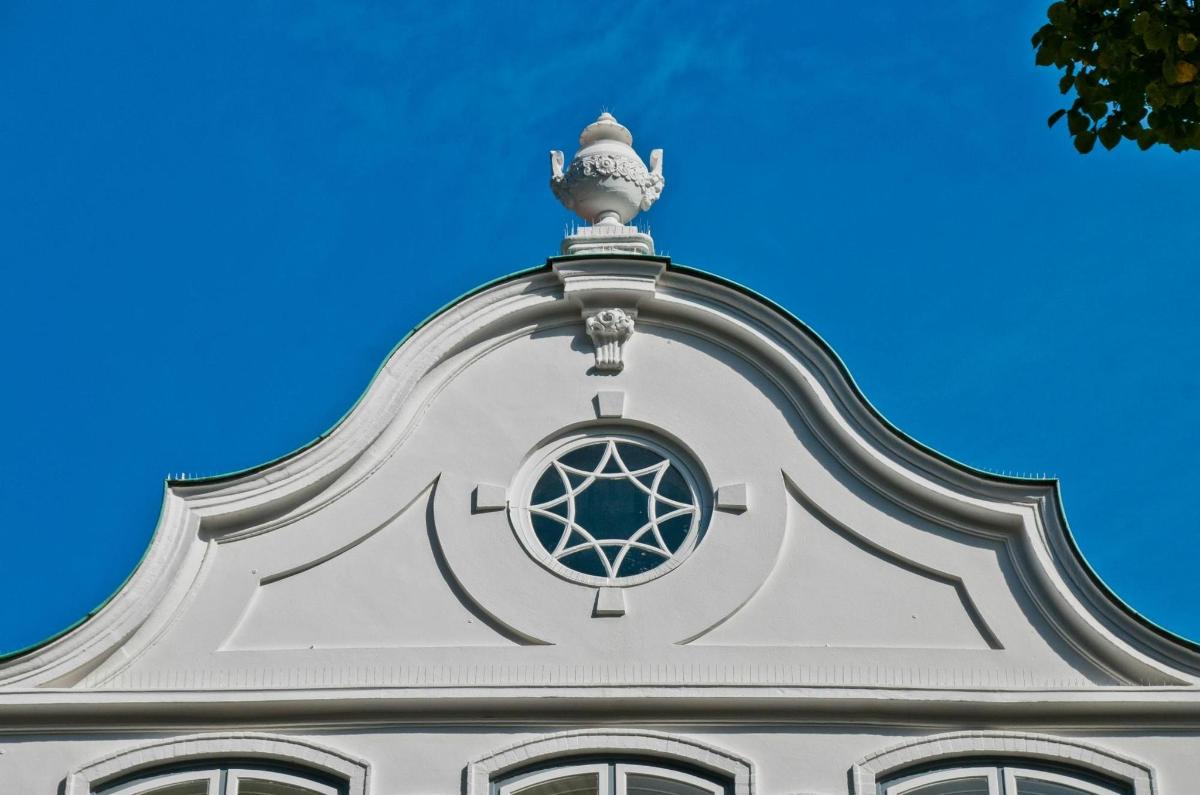 a white building with a window on top of it