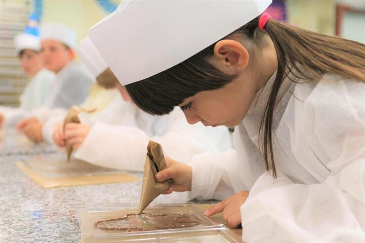 a woman in a chefs outfit preparing food in a kitchen