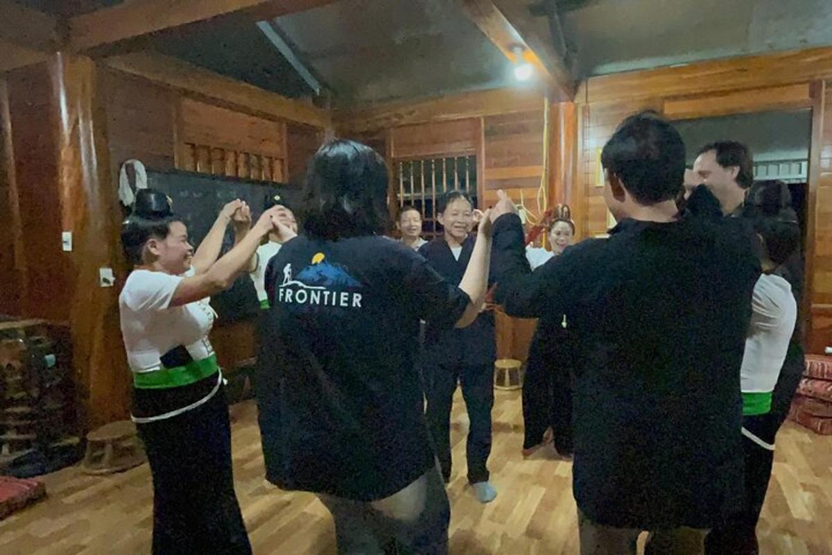 a group of people dancing in a room