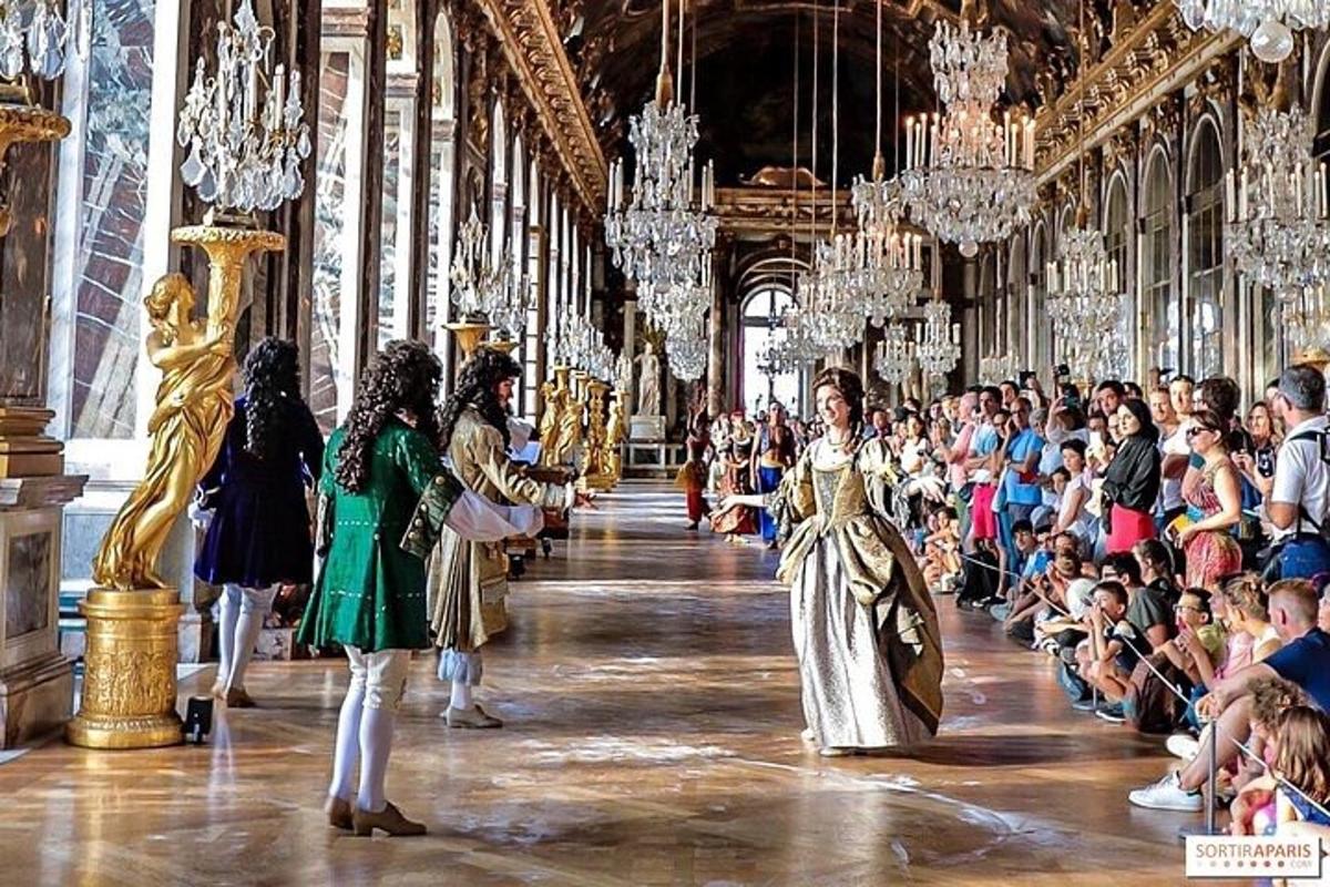 a group of people walking down a hallway in a palace