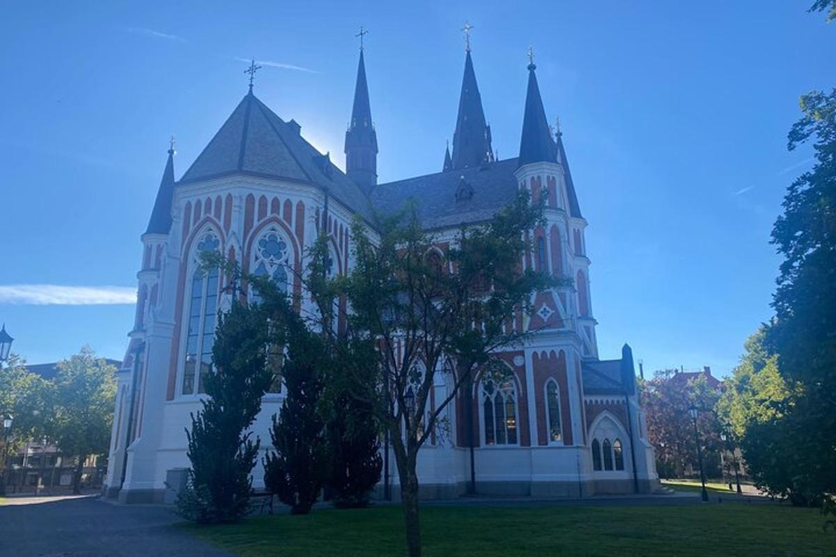 a large church with a tree in front of it