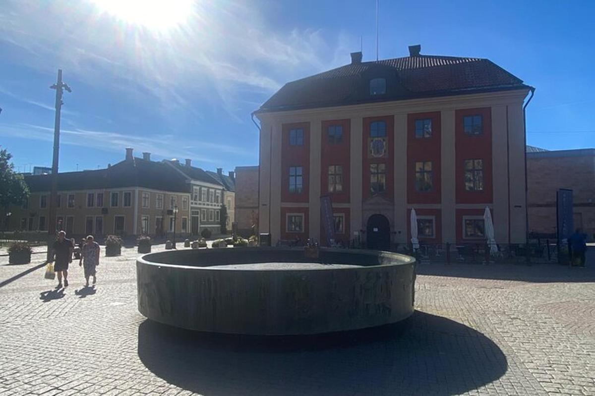 a building with a fountain in the middle of a courtyard