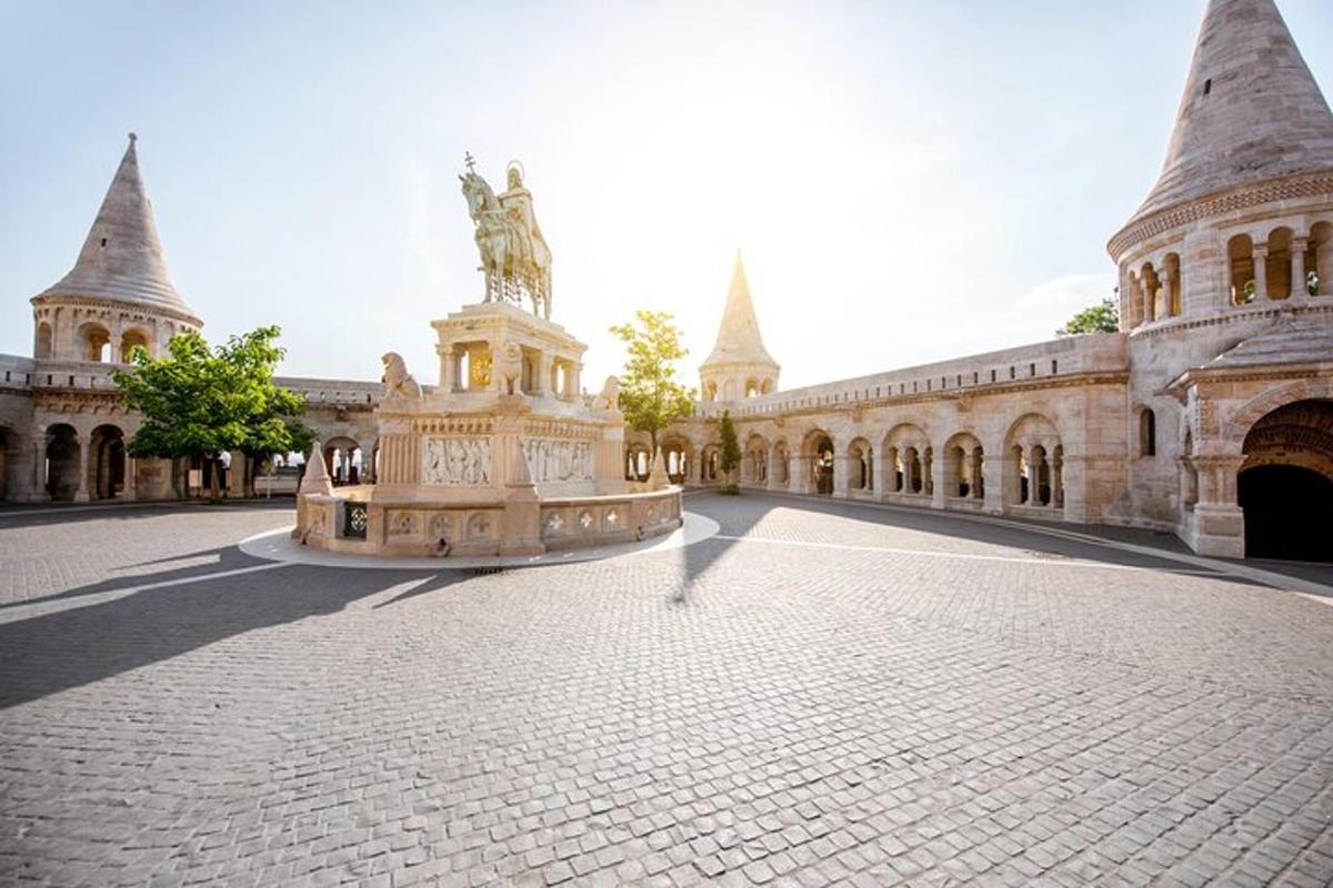 a building with a statue in the middle of a courtyard