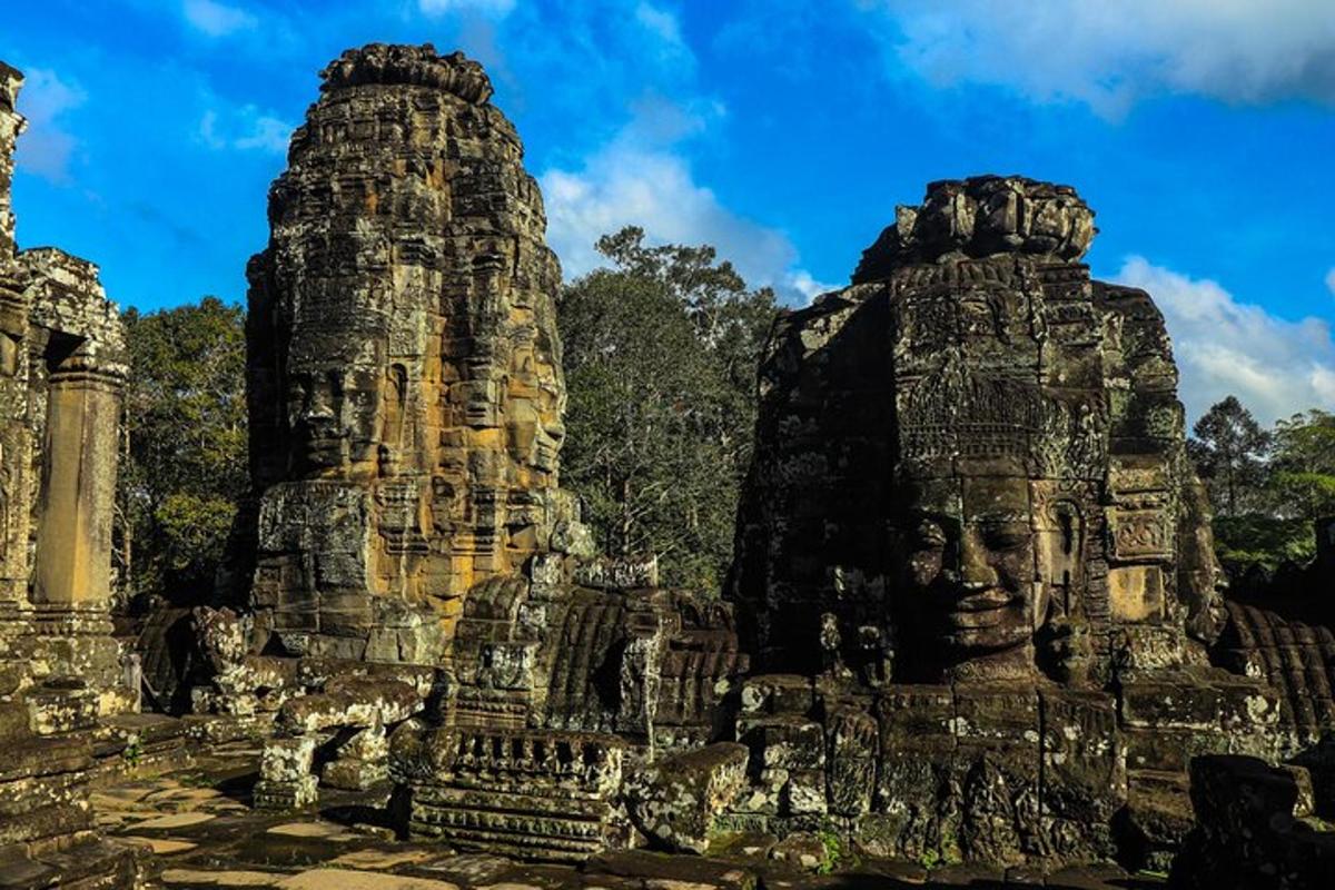two large stone structures with faces on them