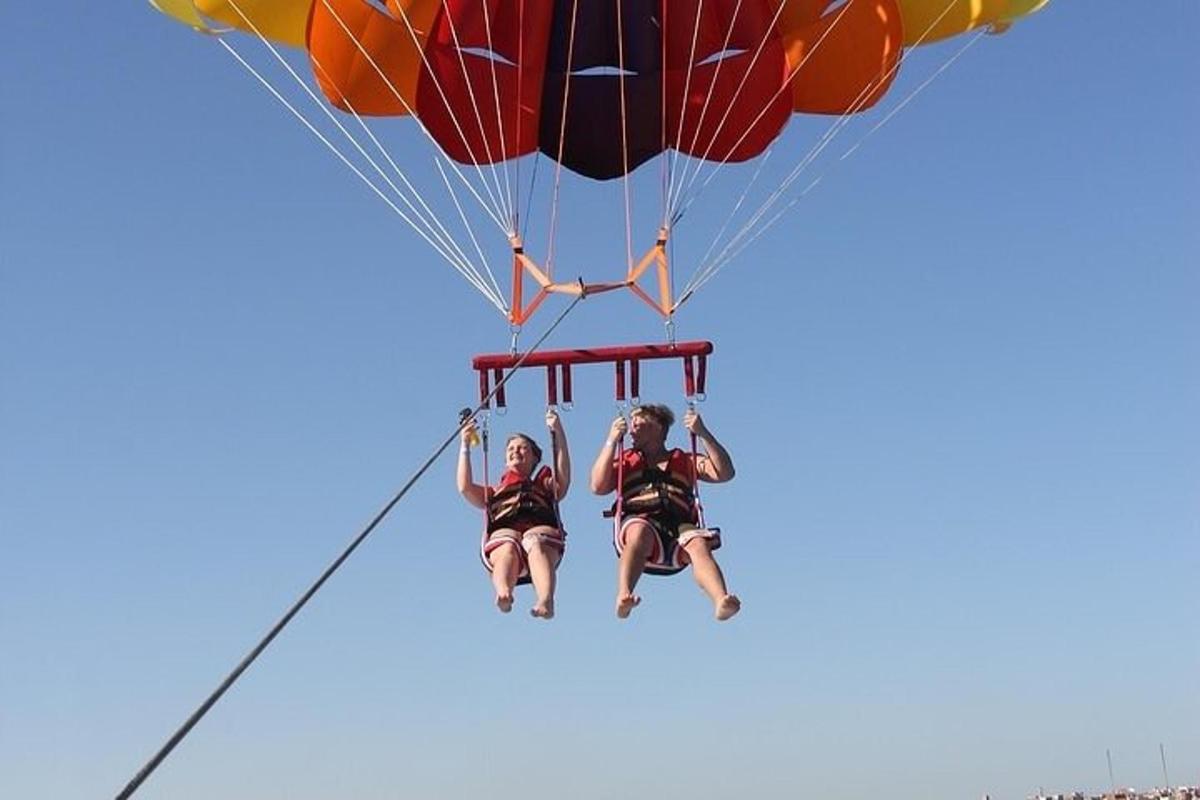 a group of people riding on a parachute