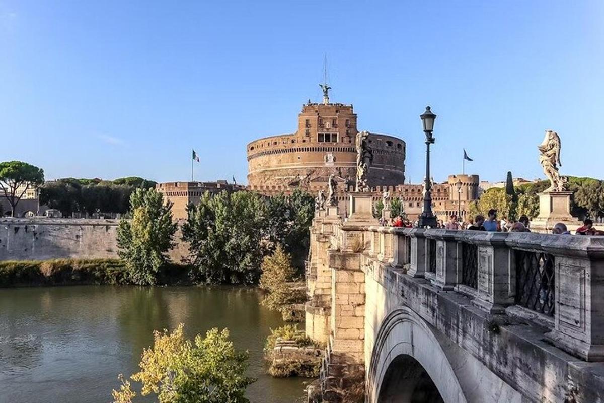 a bridge over a river with a castle in the background
