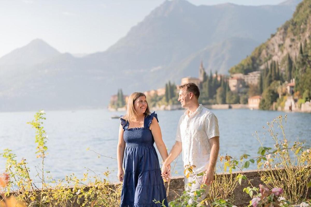 a man and a woman standing next to a lake