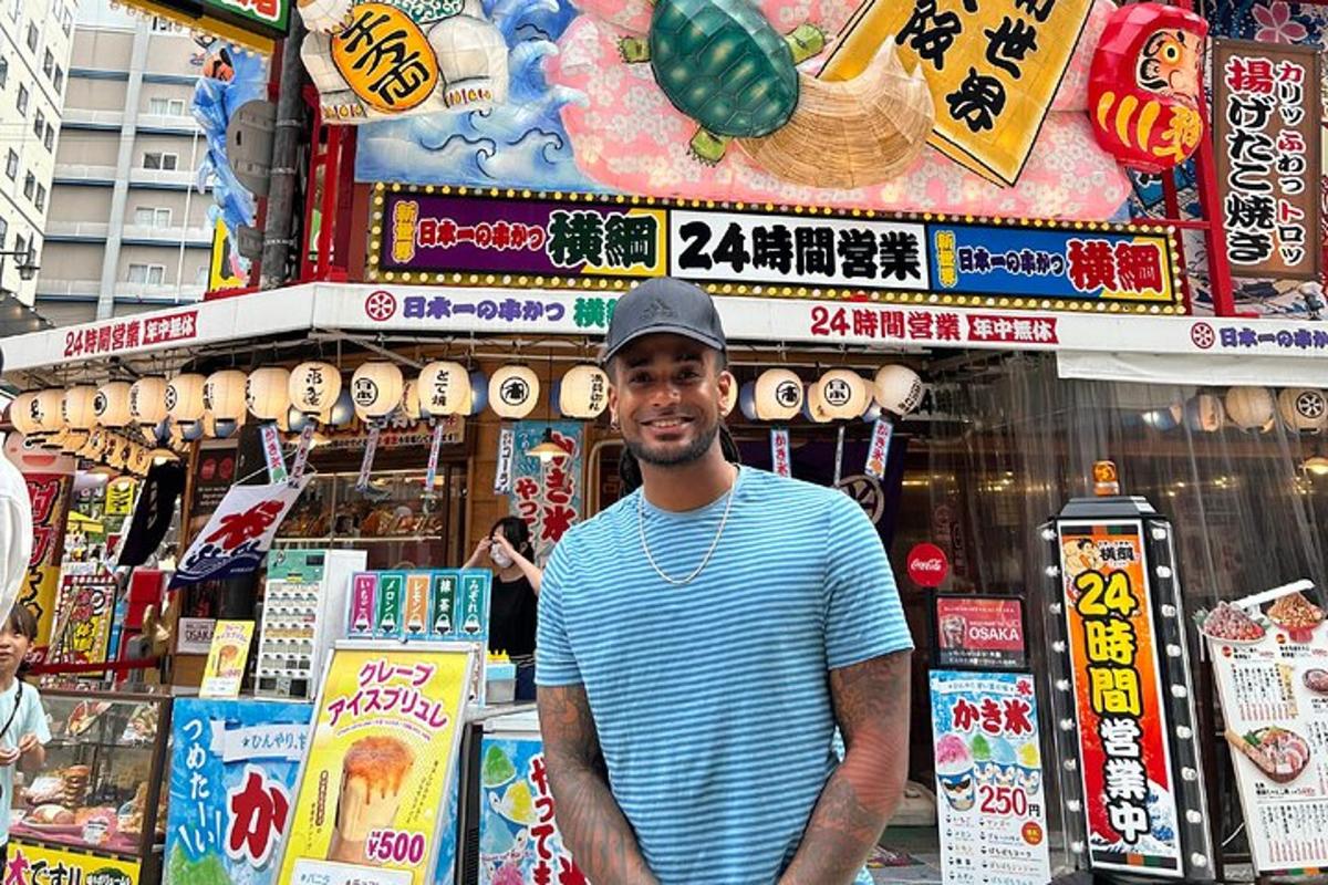 a man is standing in front of a store