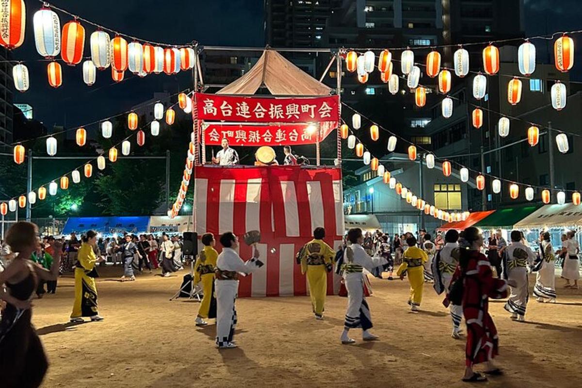 a crowd of people walking around a circus tent