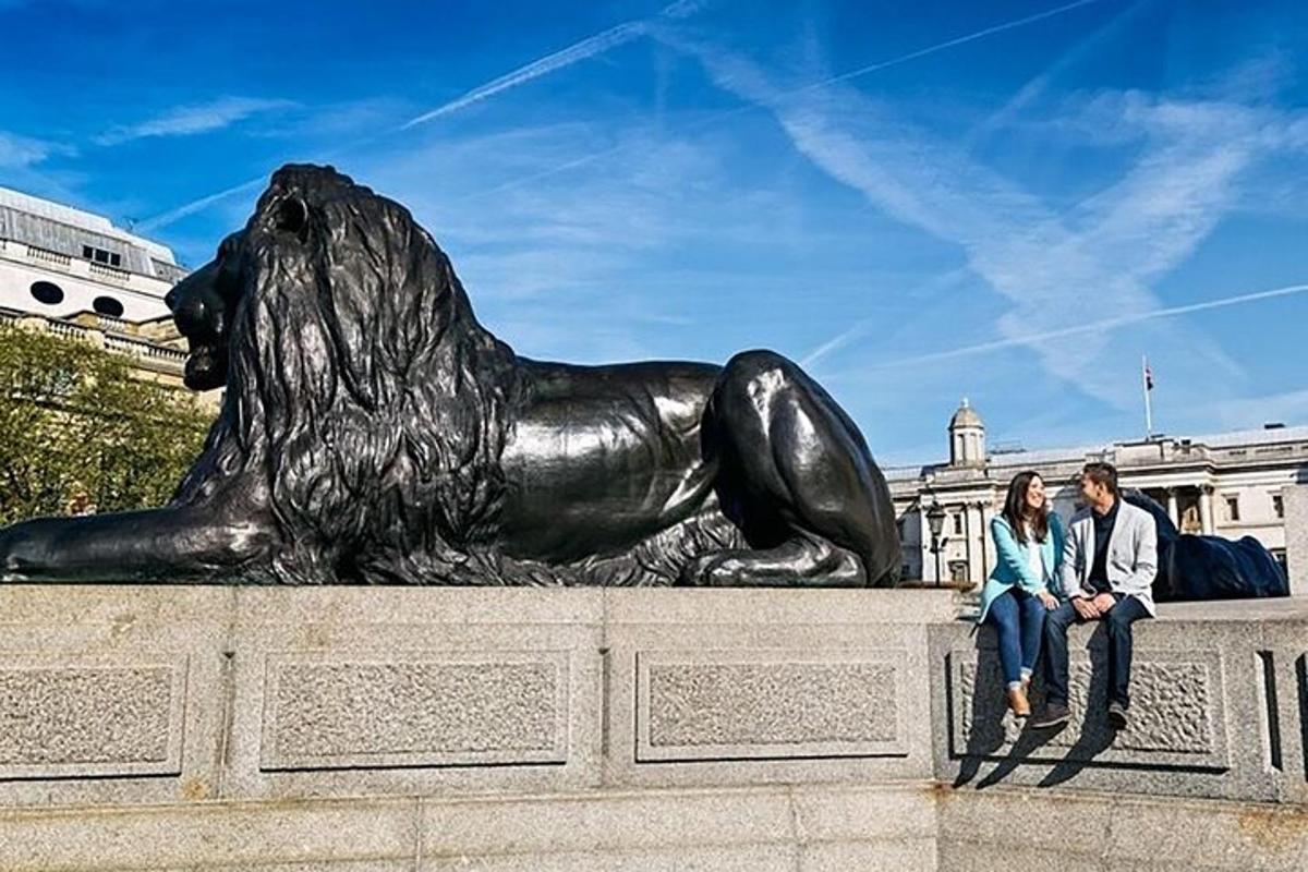 a couple sitting in front of a statue of a dog