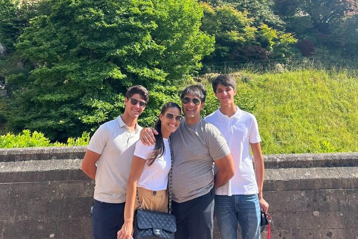 a group of people standing on a wall