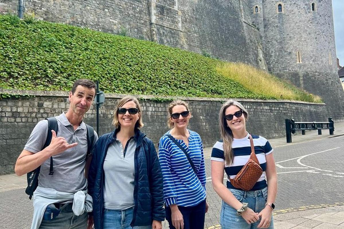 a group of people standing in front of a castle