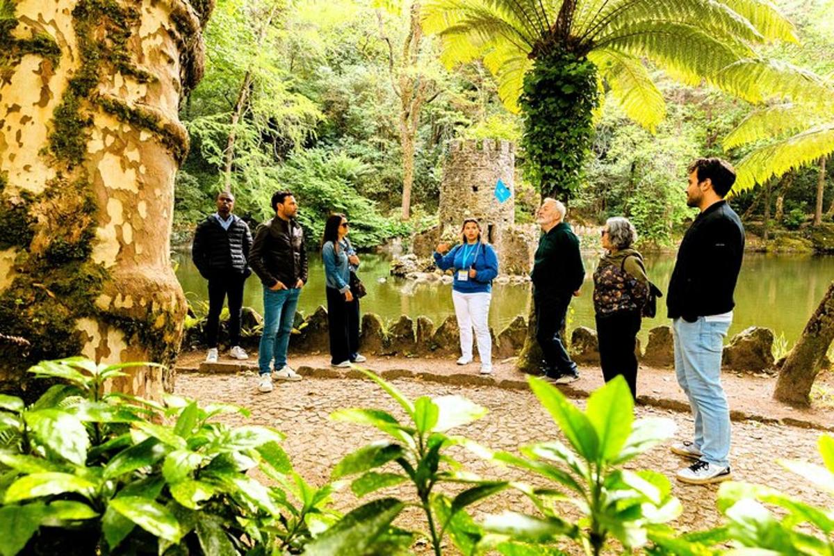 a group of people standing near a body of water